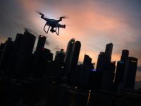 drones police Flying a drone at dusk in the city 