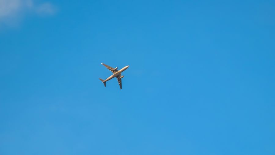 Flying Airplane Airplane in the sky. Capture of flying airplane from ground in Begaluru (Bangalore), India. bengaluru,india,karnataka