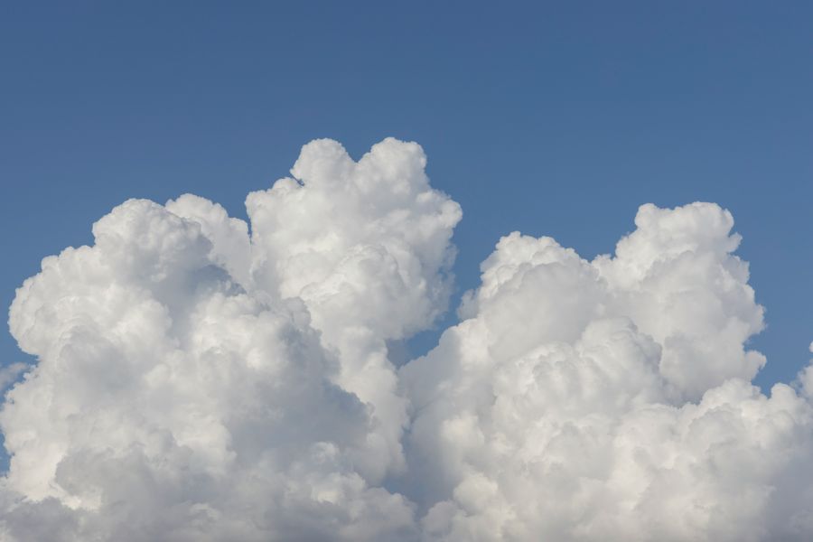 clouds fluffy clouds and blue sky background 