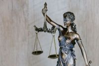 Legal battle Lady Justice background. law,legal,figurine