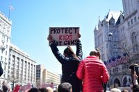children protest Near the Trump International Hotel (frame right), two young girls protest at the March For Our Lives rally in Washington, D.C. 