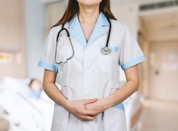 medical center Detail of stethoscope. Doctor woman with white coat and stethoscope.