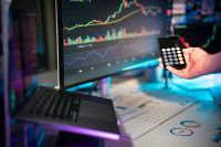 expenses business economy hand holding smartphone calculator. Financial charts. 