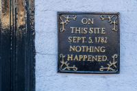 Controversial plaque A humorous sign saying that nothing happened at this place on a particular day in history. typography,words,blandford forum