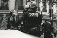 tragedy police High police presence in Lyon, France, during the 25th weekend of the yellow vests movement.

Police violence is at its highest since the 1950s. There is an extensive use of tear gas, sting-ball grenades and the LBDs ("defense ball launchers") against largely peaceful protesters. The policeman holds his hand on a LBD, shown on the left in the picture. The use of LBDs is very controversial, causing serious injuries.

As of now (May 5th), 292 persons claim to be seriously injured by rubber ball 