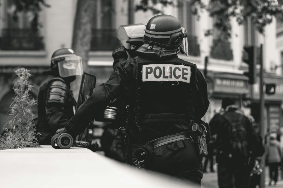 tragedy police High police presence in Lyon, France, during the 25th weekend of the yellow vests movement.

Police violence is at its highest since the 1950s. There is an extensive use of tear gas, sting-ball grenades and the LBDs ("defense ball launchers") against largely peaceful protesters. The policeman holds his hand on a LBD, shown on the left in the picture. The use of LBDs is very controversial, causing serious injuries.

As of now (May 5th), 292 persons claim to be seriously injured by rubber ball 