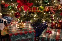 Christmas presents Christmas presents waiting to be opened underneath the Christmas tree christmas tree,christmas tree ornaments,christmas presents