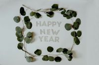 New Year Happy New Year letters surrounded by Eucalyptus branches 