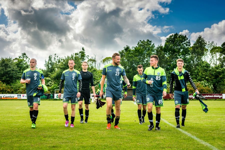 Soccer players Men walking away from soccer match team sport,team,football