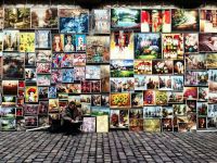 Art market Man in front of multiple art prints art,street art,kraków