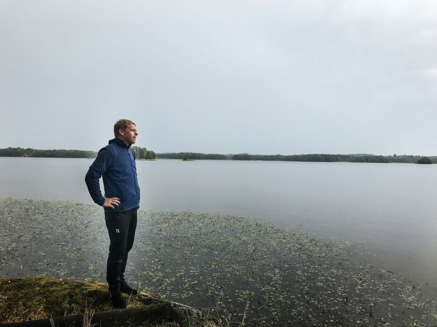 Men s Middle aged man looking out over the lake. 