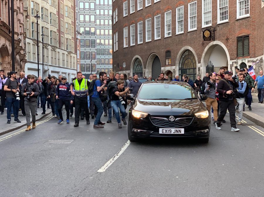 security measures Nigel Farage, the UK politician had addressed a right wing rally in nearby Parliament Square, after Theresa May’s government was defeated for the third time. He left on foot and was pursued by a crowd of supporters and press photographers. A car arrived which he jumped into, before speeding away.  security,bouncer,guard