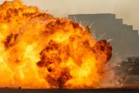 Explosion Massive fire explosion close up in military combat and war. Vehicle explosion from a tank in a city in the Middle East. Military Concept. Strength, power, explosion. fire,explode,intense