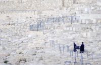 Rabbi Based on ancient Jewish traditions, every worn-out holy books, scripts, parchments that cannot be of use anymore due to aging, cannot be destructed. They are placed into a genizah or are buried in a sacred place in cemetery.

- Mount of Olives, Jerusalem - israel,cemetery,people