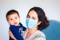 quarantine Mom with baby during Coronavirus COVID-19 outbreak. 