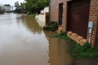 flooding rescue Sandbags prevent flooding of a house at Windsor, Western Sydney, NSW, Australia. July 5, 2022 
