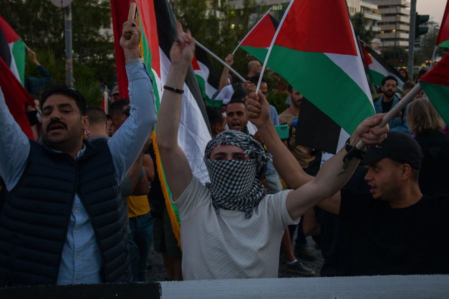 Gaza protest Palestinians protest outside the embassy of Israel in Athens, Greece, on October 9, 2023, in solidarity with the Palestinian people. An armed conflict broke out, Saturday morning, between Palestine and Israel after Hamas, an armed organization controlling the Gaza Strip fired more than 5,000 missiles at occupied Israeli territory. people,protest,palestine