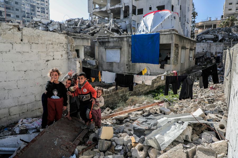 Gaza conflict Gaza - Palestine Children among the rubble of their house 