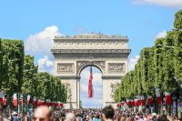 Bastille Day Arc de Triomphe with a France national flag on Bastille Day. 