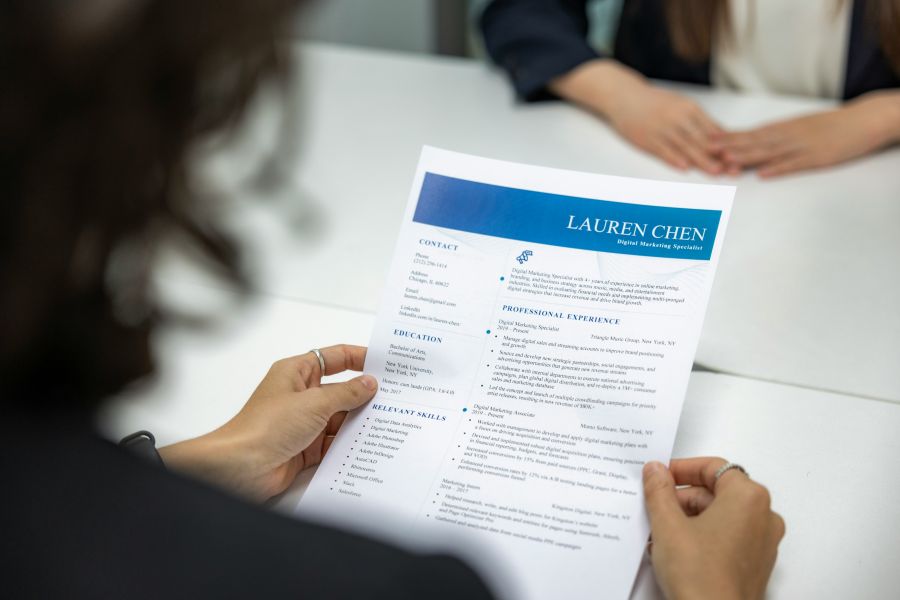 Job application Closeup view of job applicant resume and CV paper during job interview 