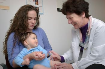 pediatrician shortage A paediatrician giving a baby a vaccine injection