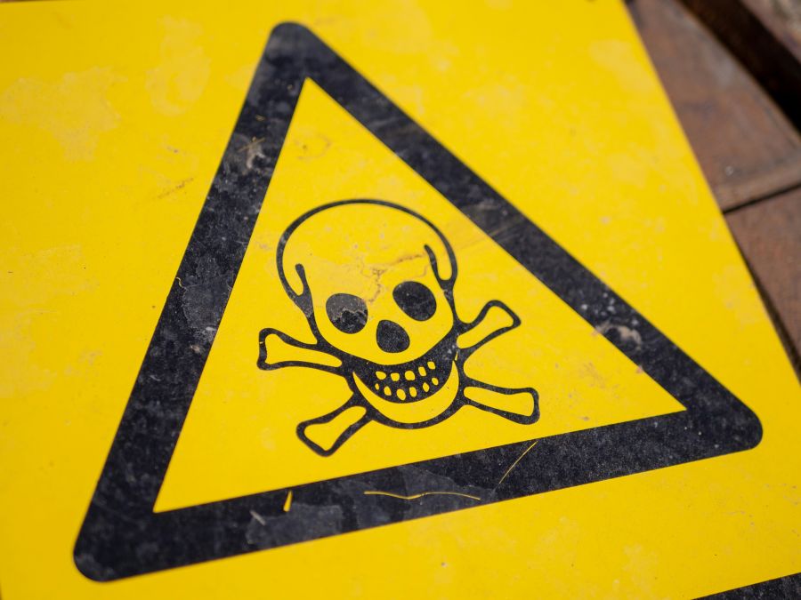 health risk Danger sign with skull 