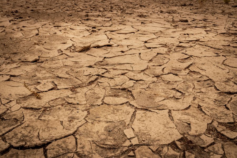 drought agriculture A desolate dusty brown riverbed with dry broken clay soil 