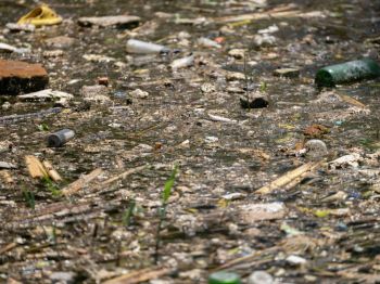 Pollution water polluted river with floating plastic waste