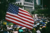 Consulate Tens of thousands of protesters waving US flags marched on Hong Kong's US Consulate to call for help from the Trump administration in ending a three-month confrontation with the government, calling for the passing of the proposed 