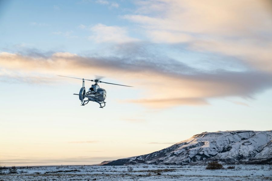 Helicopter drones A heli lifting from the ground flying into the sky 