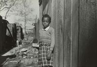 Slum shanty 1937.
Girl in Washington, D.C. slum area
Photographer: John Vachon  slum,child,grey