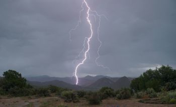 Lightning Hiker Lightning strikes Embudo Valley.