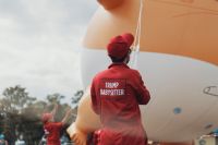 Government manipulation A team of ‘Trump babysitters’ hold on to the giant balloon of Donald Trump, with thousands of on-lookers. government,donald trump,edinburgh