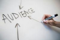 campaign Woman's hand writing the word 
