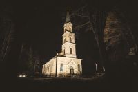 church night White lutheran church with tower in the middle of the night. 