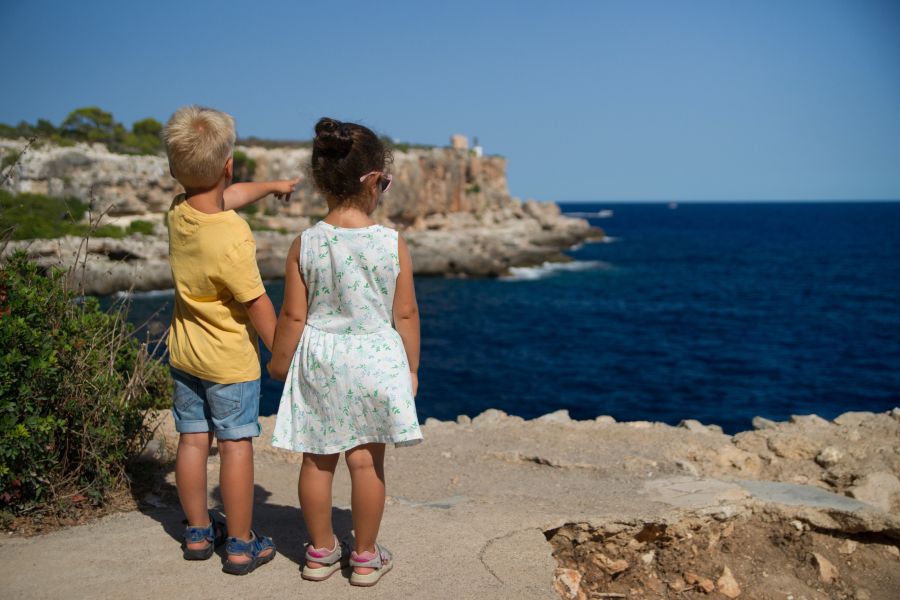 Children kids During my stay on Mallorca, I came across those little children. I was so appealed by them watching fisher boats coming in, I had to take this picture. Even if there is no boat visible, the scene with the boy apparently pointing towards the horizon is even stronger. sea,ocean view,explore the unknown