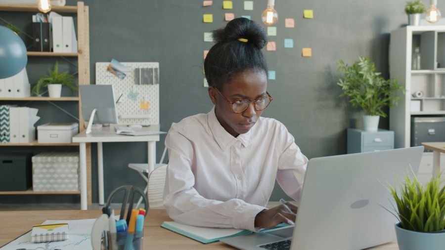 workplace stress Unhappy young woman is using laptop computer then turning off device and leaving giving up on project. Negative emotions and technology concept. 