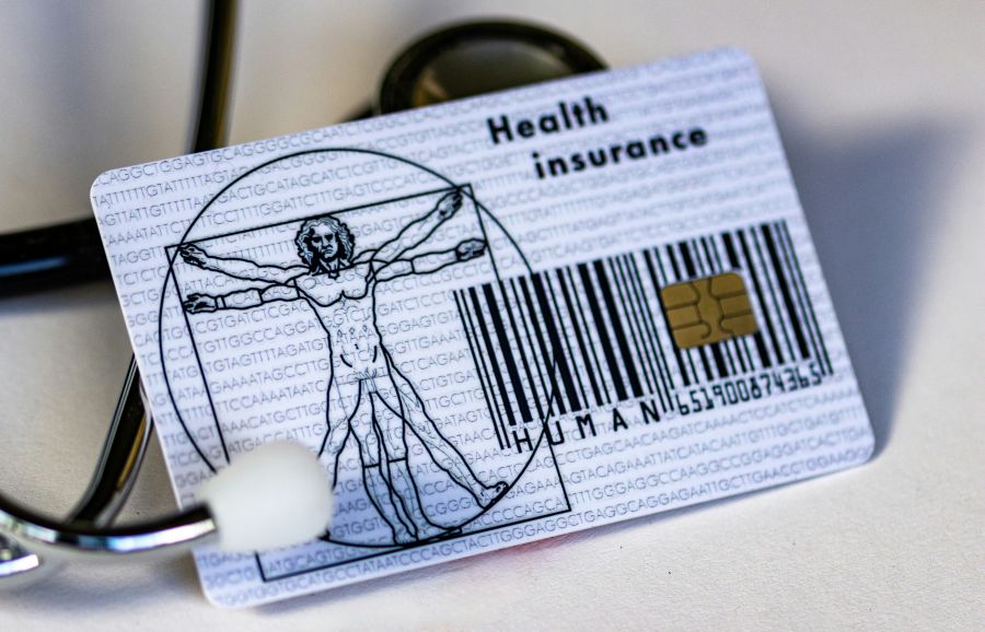 Insurance Costs a health card and a stethoscope 