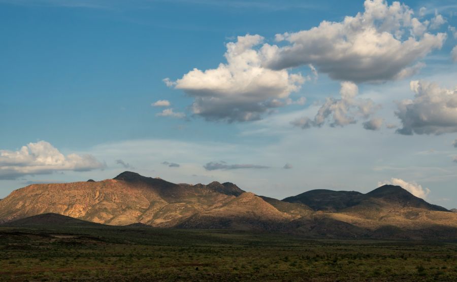 Congress Communist With the help of a setting sun, cumulus clouds cast shadows on the northern edge of the Weaver Mountains. cumulus,hillsdie,mountains