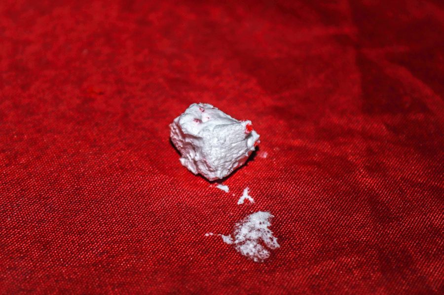 Cocaine Drugs Cream on a Red Cloth 