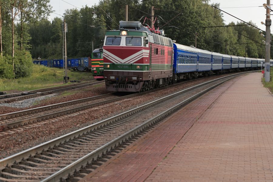 Railway Negotiations a passenger train overtakes a freight train on an adjacent track railway,train,wagons