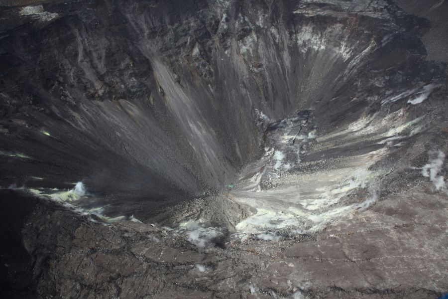 crater collapse Aerial view of Halema‘uma‘u at the summit of Kīlauea taken during a USGS Hawaiian Volcano Observatory helicopter overflight on August 1, 2019. The small green patch visible at the bottom of Halema‘uma‘u is a new pond forming at the lowest point of the crater. The pond is at about 525 m (about 1722 ft) elevation. 