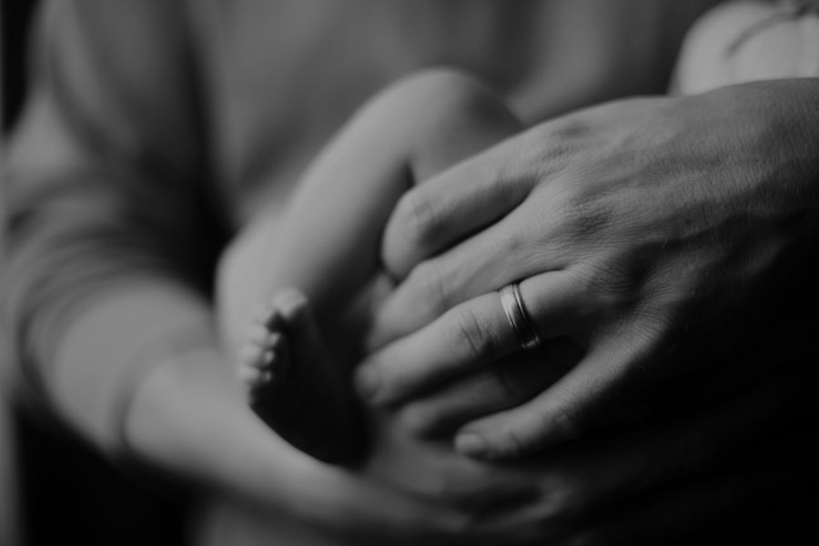 Father parent A daddy holding his new baby boy. father,baby feet,love
