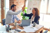 Business Administration Two middle age business workers smiling happy and confident. Working together with smile on face hand giving high five at the office success,collaboration,businessman