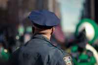 Police fraud Policeman watching the St Patrick's parade 