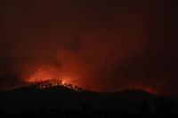 Fires Bushfire begins to crest a hill in Tasmania, Australia. fire,australia,tasmania