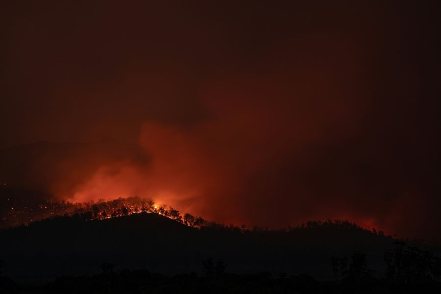 Fires Bushfire begins to crest a hill in Tasmania, Australia. fire,australia,tasmania