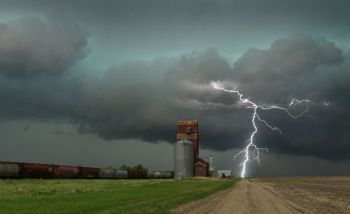 Thunderstorm Train Lightning strike near a grain elevator