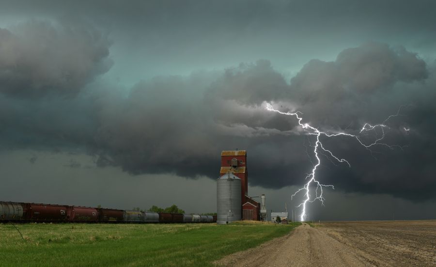 Thunderstorm Train Lightning strike near a grain elevator 