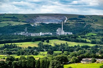 Factory Hope The Hope Cement Works opened in 1929, which predates the designation of the Peak District National Park in 1951. This accounts for the apparent anomaly of a factory site in the heart of a national park. The site was chosen because of the proximity of both limestone and shale. The Hope Cement Works' is operated by Breedon and it is the largest cement plant in the UK. The permission for the factory on this site will expire in 2042, when the site is expected to close.